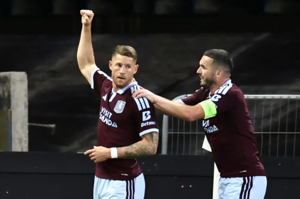 Aston Villa players celebrate their Champions League victory over Viking FK